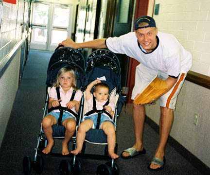 Mark Pope of the Denver Nuggets and daughters, Ella and Avery.